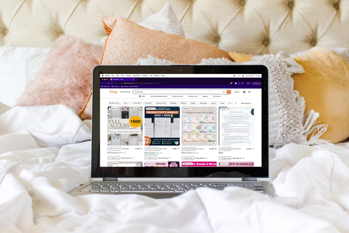 A laptop on a bed displays an Etsy shop selling digital planner templates, showcasing one of the easiest Faceless Business ideas to start from home.